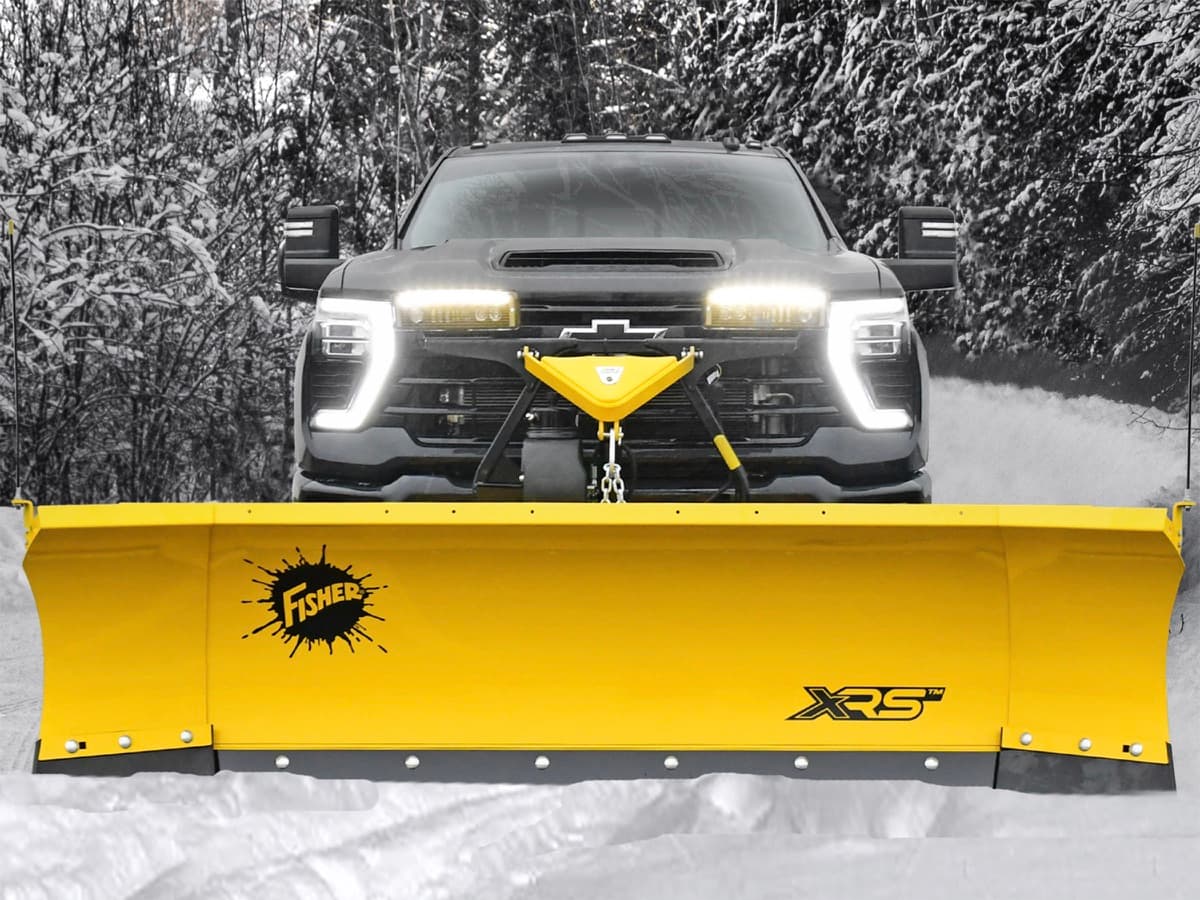 A Fisher XRS plow mounted on a pickup, built to take a hit and keep plowing